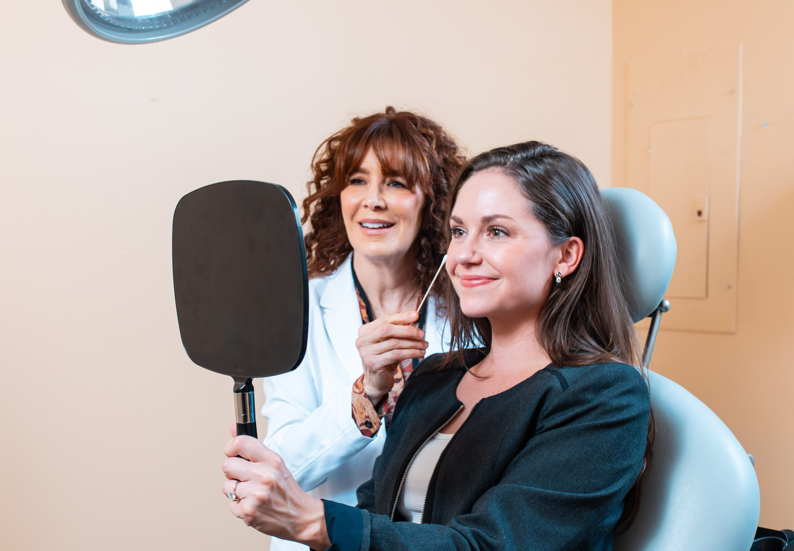 Dr. Krasnoff assessing happy patient after treatment