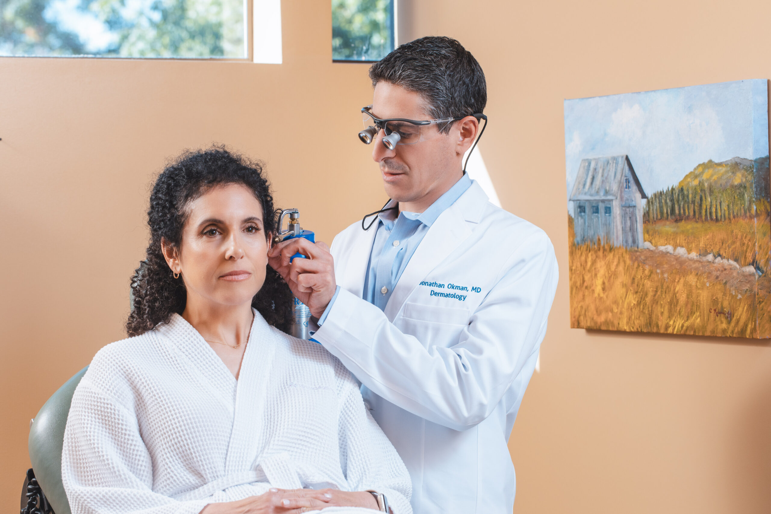 Dr. Okman performing medical exam