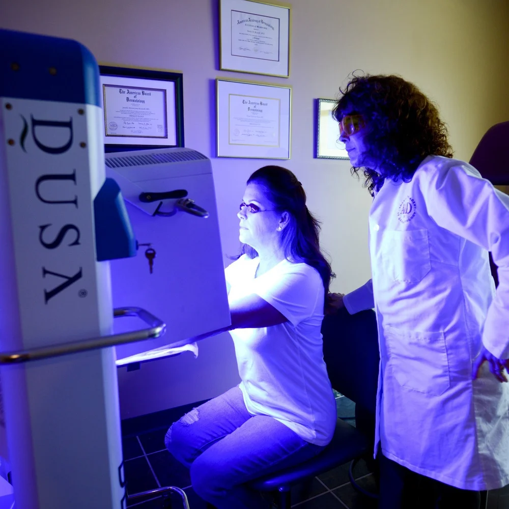 Dr. K performing photodynamic therapy on a patient