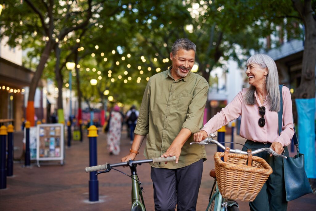 Older couple enjoying a day out with their bicycles